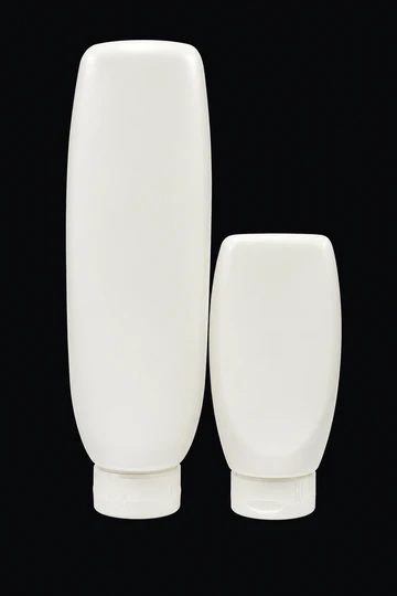 Envases blancos de pomada con tapa abatible